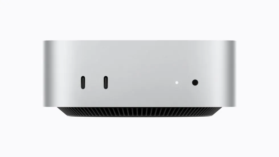 Mac mini 的正面视图,展示 2 个支持 USB 3 的 USB-C 端口和一个耳机插孔。